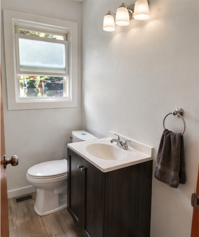 Bathroom remodeling with modern vanity, updated flooring, and clean wall finish in Detroit, MI